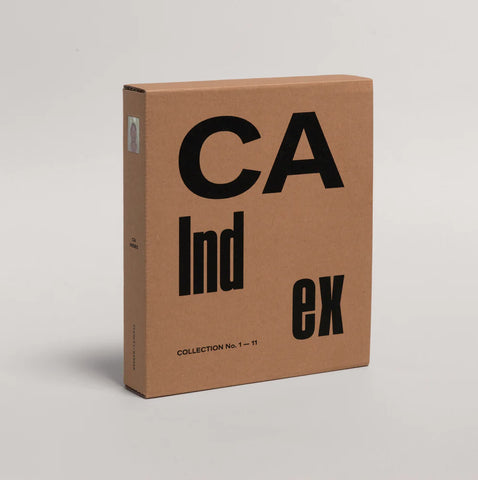 A tall rectangular cardboard box with large black text reading 'CA Ind ex' and smaller text 'COLLECTION No. 1-11' near the bottom, photographed on a clean light gray studio background.