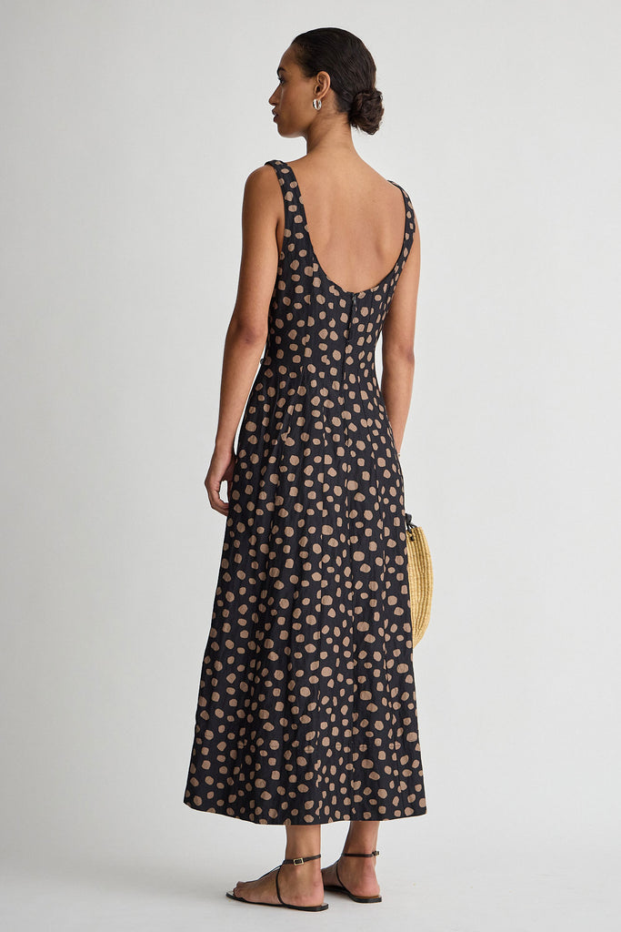 Woman wearing a black floral dress on a white background
