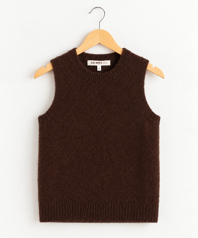 Zii Ropa brown fuzzy knit sweater vest hanging on a wooden hanger. The sleeveless top features a crew neckline and ribbed trim at the collar, armholes, and hem.