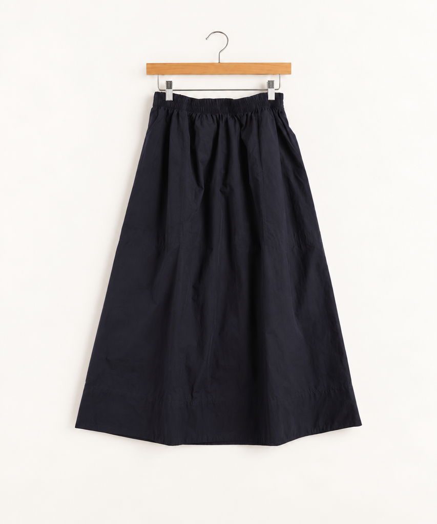 Navy blue shirt on hanger against white background