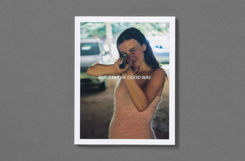 Bookcover of a woman with text 'RUDE IN THE GOOD WAY' on a gray background