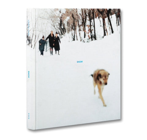 Book cover with a snowy landscape and people walking a dog