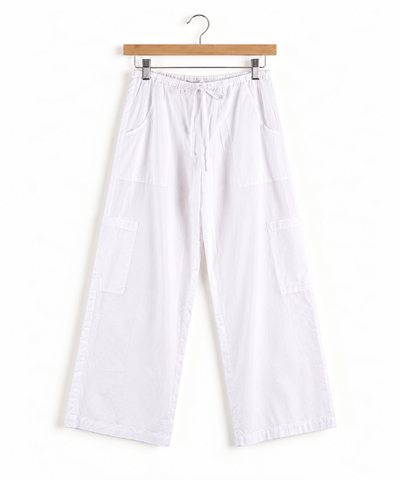 White wide-leg pants with a drawstring waist, side pockets, hanging from hanger against a plain white background.
