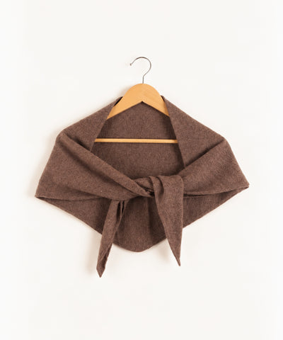 brown cashmere shawl on hanger against white background