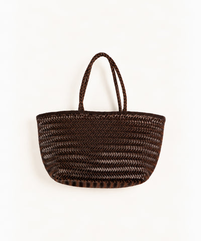 brown woven leather tote bag on white background