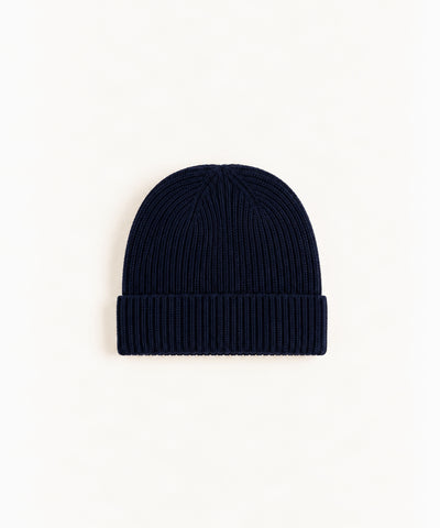 navy wool beanie on white background