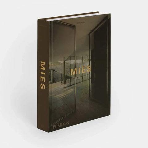 Picture of brown book with architectural photograph on cover and gold words that say MIES on cover and spine